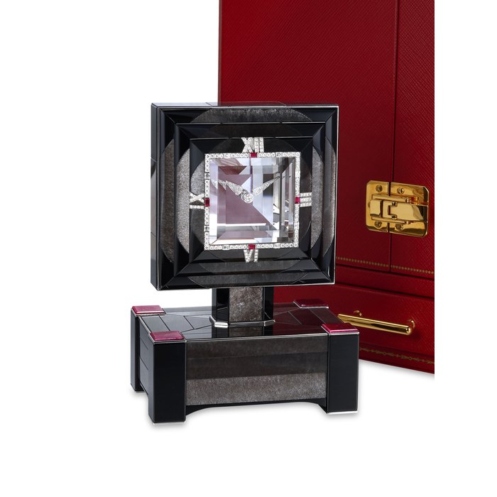 CARTIER. A STUNNING AND EXTREMELY RARE 18K WHITE GOLD, RUBY AND DIAMOND-SET MYSTERY CLOCK WITH ONYX AND OBSIDIAN CASE NO. 000003SP