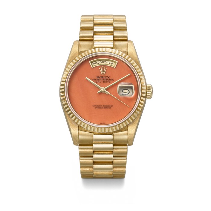 ROLEX. A VERY RARE AND HIGHLY ATTRACTIVE 18K GOLD AUTOMATIC WRISTWATCH WITH SWEEP CENTRE SECONDS, DAY, DATE, CORAL DIAL AND BRACELET SIGNED ROLEX, DAY-DATE MODEL, REF. 18238, CASE NO. L410513, CIRCA 1989