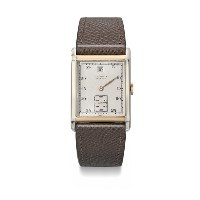 AUDEMARS PIGUET MADE FOR E. GUBELIN. A VERY RARE, ELEGANT AND ART DECO 18K WHITE GOLD AND 18K PINK GOLD RECTANGULAR JUMP HOUR WRISTWATCH SIGNED E. GUBELIN, LUCERNE, NO. 33'634, CIRCA 1926