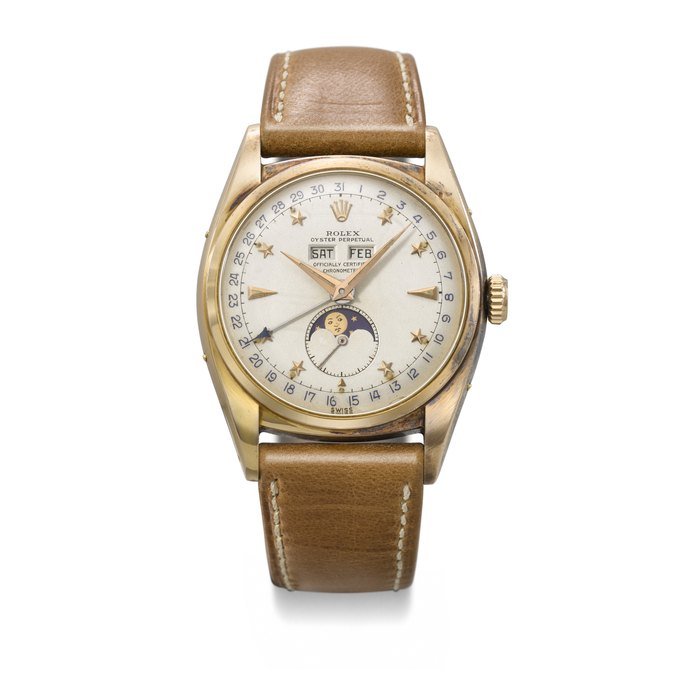 Rolex ROLEX. AN EXCEEDINGLY RARE AND OUTSTANDINGLY WELL PRESERVED 18K PINK GOLD AUTOMATIC TRIPLE CALENDAR WRISTWATCH WITH MOON PHASES AND STAR HOUR MARKERS SIGNED ROLEX, OYSTER PERPETUAL, 'STELLINE' MODEL, REF. 6062, CASE NO. 788’629, CIRCA 1952 · 6062