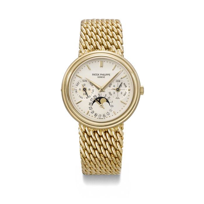 PATEK PHILIPPE. A RARE AND ELEGANT 18K GOLD AUTOMATIC PERPETUAL CALENDAR WRISTWATCH WITH MOON PHASES, 24 HOUR, LEAP YEAR INDICATION AND BRACELET SIGNED PATEK PHILIPPE, REF. 3945⁄1, MOVEMENT NO. 772'590, CASE NO. 2'875'189, CIRCA 1995