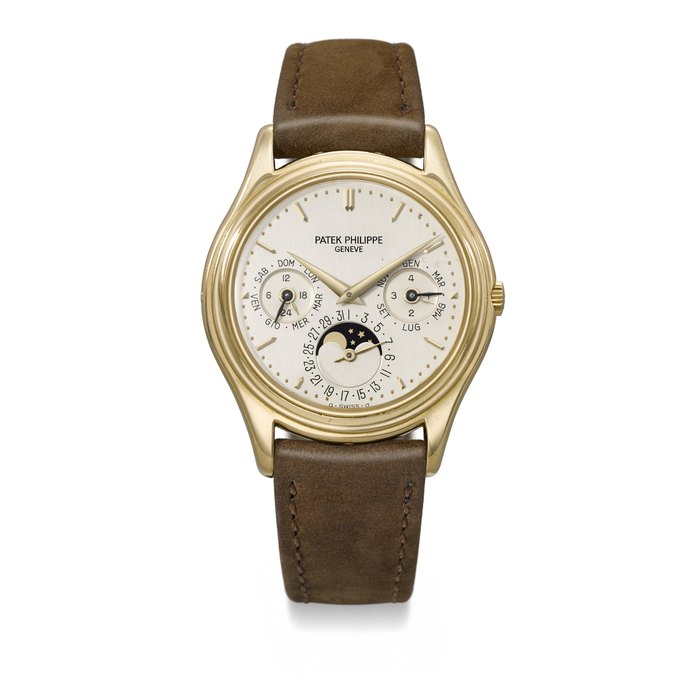PATEK PHILIPPE. A VERY RARE AND COVETED 18K GOLD AUTOMATIC PERPETUAL CALENDAR WRISTWATCH WITH MOON PHASES, 24-HOUR AND LEAP YEAR INDICATION SIGNED PATEK PHILIPPE, REF. 3940, MOVEMENT NO. 770'505, CASE NO. 2'831'524, MANUFACTURED 1987