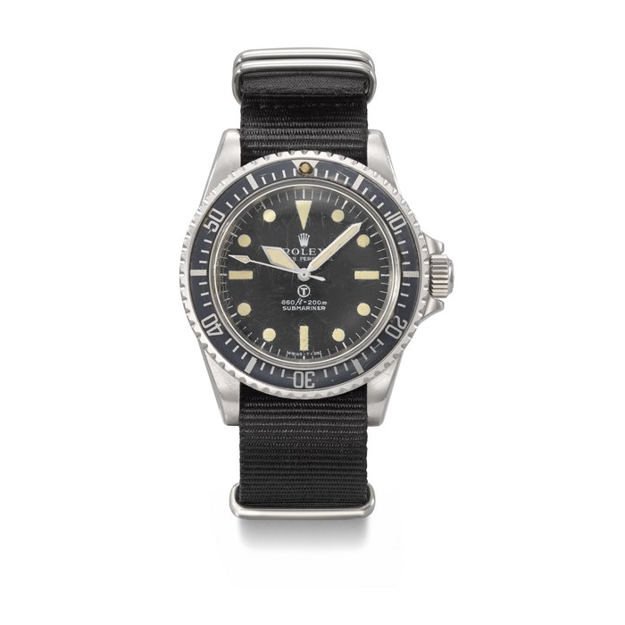ROLEX. A VERY RARE AND IMPORTANT STAINLESS STEEL AUTOMATIC WRISTWATCH WITH SWEEP CENTRE SECONDS AND HACK FEATURE, MADE FOR THE BRITISH ROYAL NAVY SIGNED ROLEX, SUBMARINER 'MILSUB' MODEL, REF. 5513, CASE NO. 3'764'780, CIRCA 1974