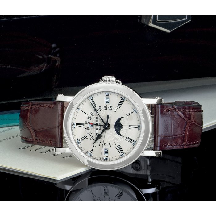 PATEK PHILIPPE. A FINE 18K WHITE GOLD AUTOMATIC PERPETUAL CALENDAR WRISTWATCH WITH RETROGRADE DATE, MOON PHASES AND ORIGINAL CERTIFICATE SIGNED PATEK PHILIPPE, GENEVE, MOVEMENT NO. 3410904, CASE NO. 4436130, REF. 5159, CIRCA 2008