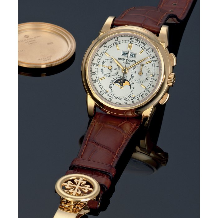PATEK PHILIPPE. A FINE AND RARE 18K GOLD PERPETUAL CALENDAR CHRONOGRAPH WRISTWATCH WITH MOON PHASES, ORIGINAL CERTIFICATE AND ADDITIONAL GOLD CASE BACK SIGNED PATEK PHILIPPE, GENEVE, MOVEMENT NO. 3049310, CASE NO. 4452655, REF. 5970, CIRCA 2008