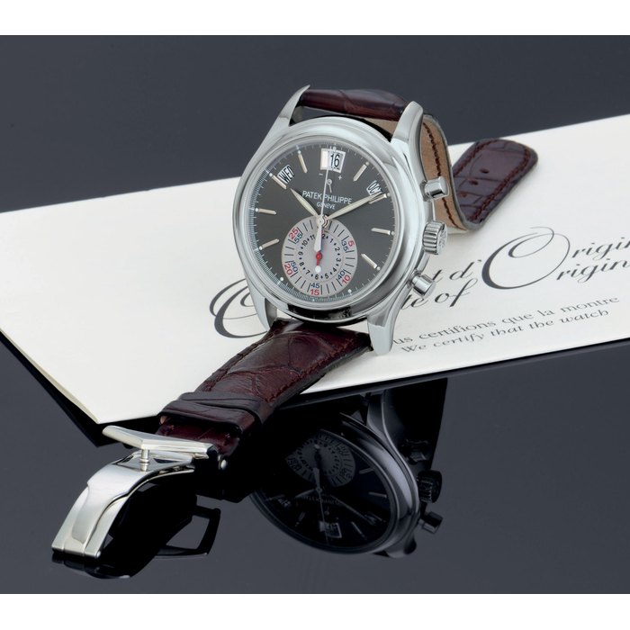 PATEK PHILIPPE. A FINE PLATINUM AUTOMATIC ANNUAL CALENDAR FLYBACK CHRONOGRAPH WRISTWATCH WITH POWER RESERVE INDICATION AND ORIGINAL CERTIFICATE SIGNED PATEK PHILIPPE, GENEVE, MOVEMENT NO. 3501511, CASE NO. 4392058, REF. 5960, CIRCA 2007