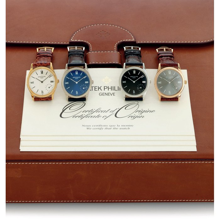 PATEK PHILIPPE. A FINE AND RARE LIMITED EDITION SET OF FOUR AUTOMATIC WRISTWATCHES ONE EACH IN YELLOW, WHITE AND PINK GOLD AND PLATINUM, CELEBRATING THE MILLENNIUM SIGNED PATEK PHILIPPE, GENEVE, CALATRAVA MODEL, REF NO. 5026, MOVEMENT NOS. 3151460, 3151249, 3151417, 3151498, MANUFACTURED IN 2001