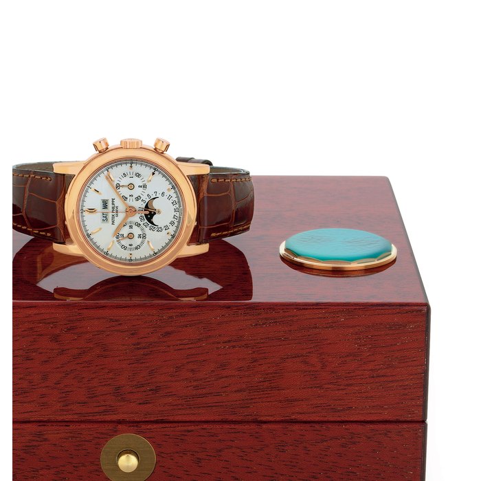 PATEK PHILIPPE. A FINE AND RARE 18K PINK GOLD PERPETUAL CALENDAR CHRONOGRAPH WRISTWATCH WITH MOON PHASES AND ADDITIONAL PINK GOLD CASE BACK SIGNED PATEK PHILIPPE, GENEVE, MOVEMENT NO. 3046040, CASE NO. 4010783, REF. 3970E, MANUFACTURED IN 1999