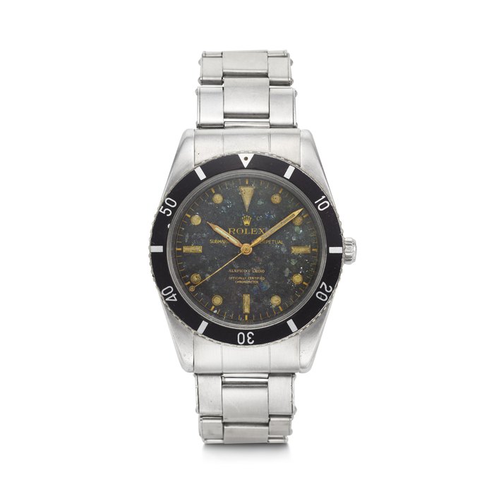 ROLEX, RETAILED BY SERPICO Y LAINO. A SUPREMLY RARE, EARLY AND HISTORICALLY IMPORTANT STAINLESS STEEL AUTOMATIC WRISTWATCH SWEEP CENTER SECONDS, BRACELET AND ‘SPLIT LOGO’ DIAL SUBMARINER ‘SPLIT LOGO’ MODEL, RETAILED BY SERPICO Y LAINO, REF. 6204, CASE NO. 949’197, CIRCA 1953