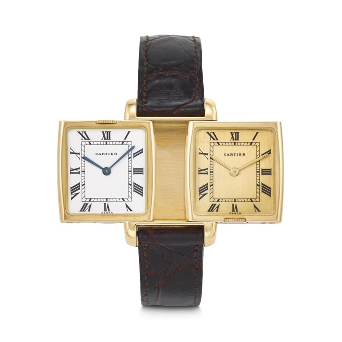 CARTIER. AN EXTREMELY RARE AND ELEGANT DUAL TIME REVERSIBLE WRISTWATCH WITH GOLD AND WHITE DIALS REVERSO 'DUAL TIME' PARIS MODEL, CASE NO. 035'443, 8 652, CIRCA 1970s