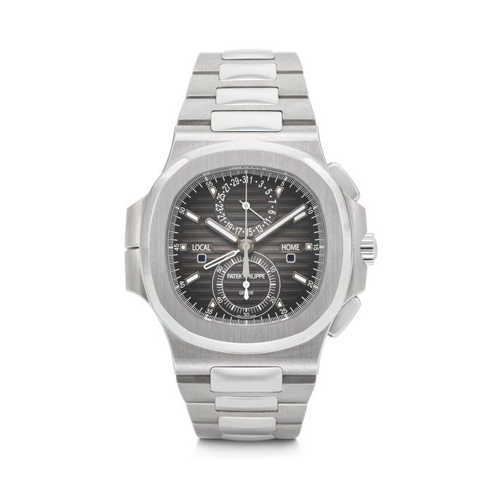 PATEK PHILIPPE. A COVETED AND SPORTY STAINLESS STEEL AUTOMATIC FLYBACK CHRONOGRAPH DUAL TIME WRISTWATCH WITH DAY/NIGHT INDICATORS, DATE AND BRACELET NAUTILUS 'TRAVEL TIME' MODEL, REF. 5990/1A-001, MOVEMENT NO. 7'246'194, CASE NO. 6'241'997, CIRCA 2019