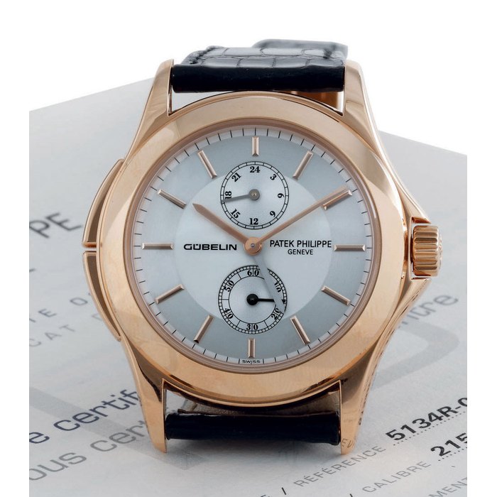 PATEK PHILIPPE. A FINE LIMITED EDITION 18K PINK GOLD DUAL TIME WRISTWATCH WITH 24 HOURS AND ORIGINAL CERTIFICATE SIGNED PATEK PHILIPPE, GENEVE, CALATRAVA TRAVEL TIME, MOVEMENT NO. 3085994, CASE NO. 4237294, REF. 5134, MADE FOR THE 150TH ANNIVERSARY OF GÜBELIN, MANUFACTURED IN 2003