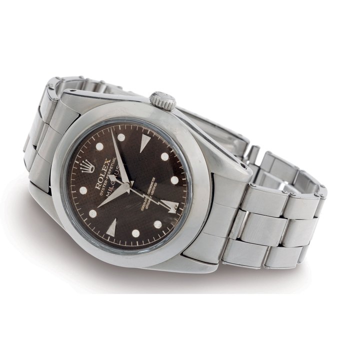 ROLEX. A RARE STAINLESS STEEL AUTOMATIC CENTER ANTI-MAGNETIC WRISTWATCH WITH CENTER SECONDS, HONEYCOMB DIAL, TRANSITIONAL CASE AND BRACELET SIGNED ROLEX, OYSTER PERPETUAL, MILGAUSS, CASE NO. 412060, REF. 6541, CIRCA 1958