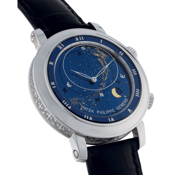 PATEK PHILIPPE. A FINE AND EXTREMELY RARE 18K WHITE GOLD AUTOMATIC ASTRONOMICAL WRISTWATCH WITH SKY CHART, PHASES AND ORBIT OF THE MOON AND TIME OF MERIDIAN PASSAGE OF SIRIUS AND OF THE MOON SIGNED PATEK PHILIPPE, GENEVE, CELESTIAL, MOVEMENT NO. 3328070, CASE NO. 4214502, REF. 5102G-001, MANUFACTURED IN 2003