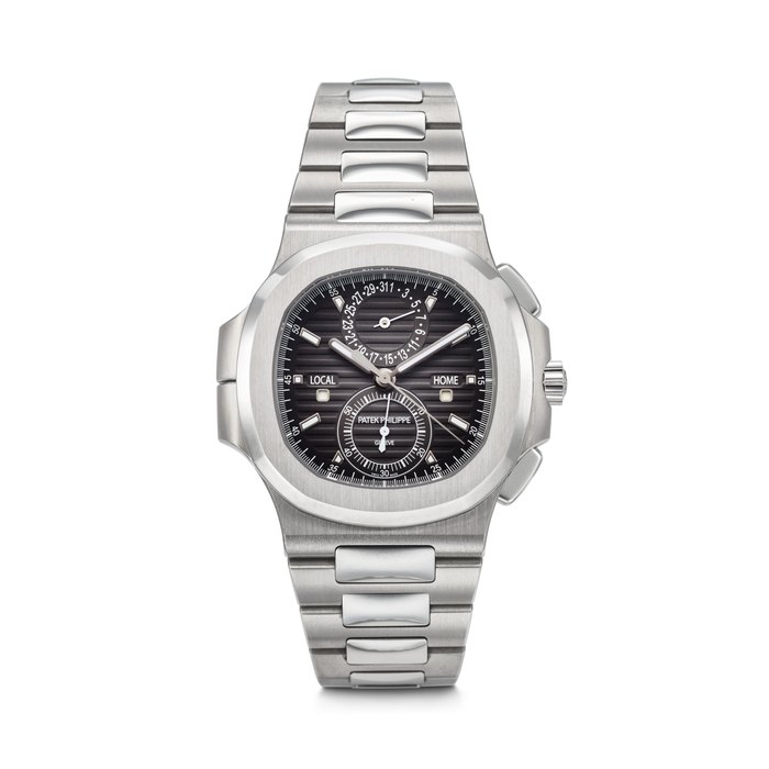 PATEK PHILIPPE. A COVETED AND LARGE STAINLESS STEEL AUTOMATIC FLYBACK CHRONOGRAPH DUAL TIME WRISTWATCH WITH DAY/NIGHT INDICATOR, DATE AND BRACELET SIGNED PATEK PHILIPPE, NAUTILUS MODEL, REF. 5990/1A-001, MOVEMENT NO. 7'276'958, CASE NO. 6'314'989, CIRCA 2019