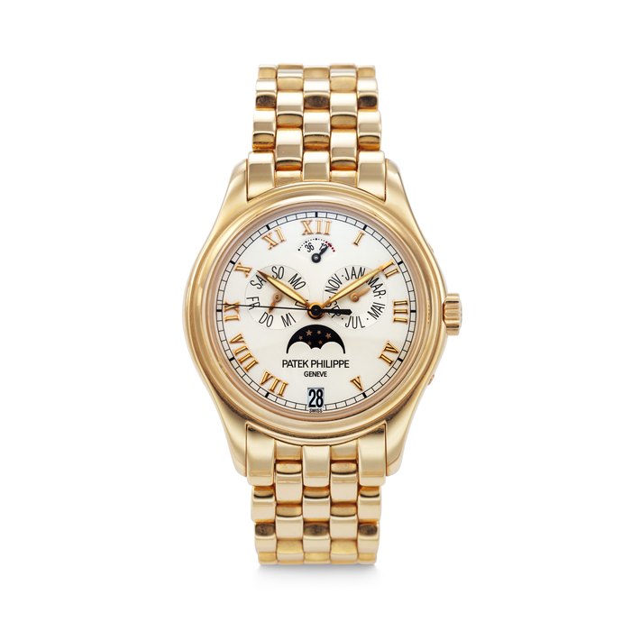 PATEK PHILIPPE. AN ATTRACTIVE 18K PINK GOLD AUTOMATIC ANNUAL CALENDAR WRISTWATCH WITH SWEEP CENTRE SECONDS, MOON PHASES, POWER RESERVE AND BRACELET SIGNED PATEK PHILIPPE, REF. 5036/1R-001, MOVEMENT NO. 3'145'907, CASE NO. 4'146'447, CIRCA 2001
