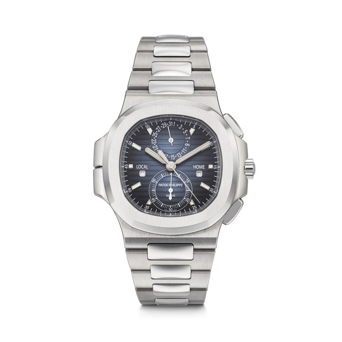 PATEK PHILIPPE. A DESIRABLE STAINLESS STEEL AUTOMATIC FLYBACK CHRONOGRAPH DUAL TIME WRISTWATCH WITH DAY/NIGHT INDICATORS, DATE AND BRACELET NAUTILUS 'TRAVEL TIME' MODEL, REF. 5990/1A-011, CIRCA 2022
