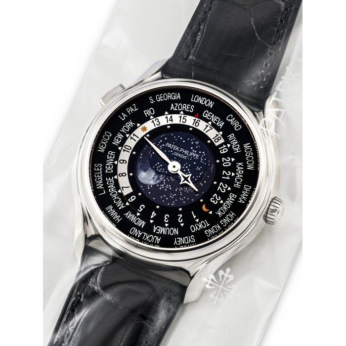 PATEK PHILIPPE. AN 18K WHITE GOLD LIMITED EDITION AUTOMATIC WORLD TIME WRISTWATCH WITH MOON PHASES, MADE TO COMMEMORATE THE 175TH ANNIVERSARY OF PATEK PHILIPPE, SINGLE SEALED REF. 5575G-001, MOVEMENT NO. 5'901'363, CASE NO. 6'058'025, CIRCA 2016