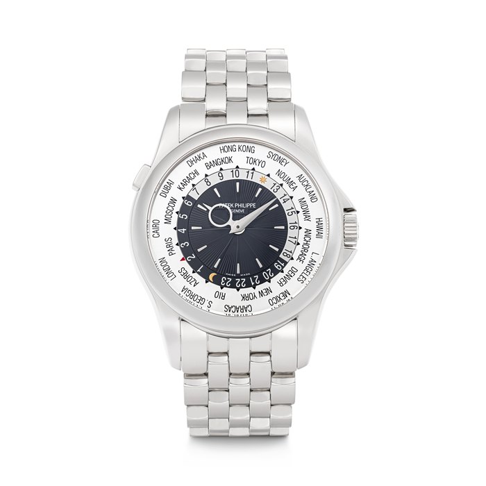 PATEK PHILIPPE. AN 18K WHITE GOLD AUTOMATIC WORLD TIME WRISTWATCH WITH BRACELET REF. 5130/1G-010, MOVEMENT NO. 5'658'752, CASE NO. 4'577'292