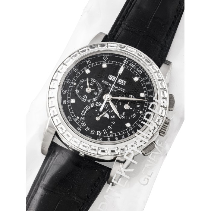 Patek Philippe PATEK PHILIPPE. A RARE PLATINUM AND BAGUETTE-CUT DIAMOND-SET PERPETUAL CALENDAR CHRONOGRAPH WRISTWATCH WITH MOON PHASES, 24 HOUR AND LEAP YEAR INDICATION, SINGLE SEALED REF. 5971P-001, MOVEMENT NO. 3'048'936, CASE NO. 4'441'215, CIRCA 2008, Price & Market Data