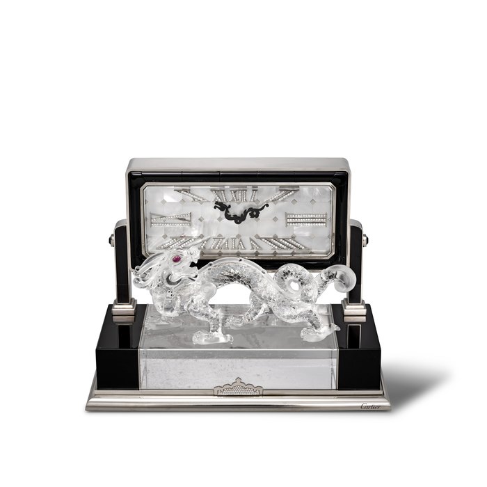 CARTIER. AN EXTREMELY RARE, EXCEPTIONAL AND HIGHLY ATTRACTIVE, 18K WHITE GOLD, ROCK CRYSTAL, ONYX, DIAMOND AND RUBY SET LIMITED EDITION TABLE CLOCK WITH MOTHER-OF-PEARL DIAL 'DRAGON' DE CARTIER DECOR CLOCK MODEL, REF. CRW0100088, NO. 1⁄8, CIRCA 2009