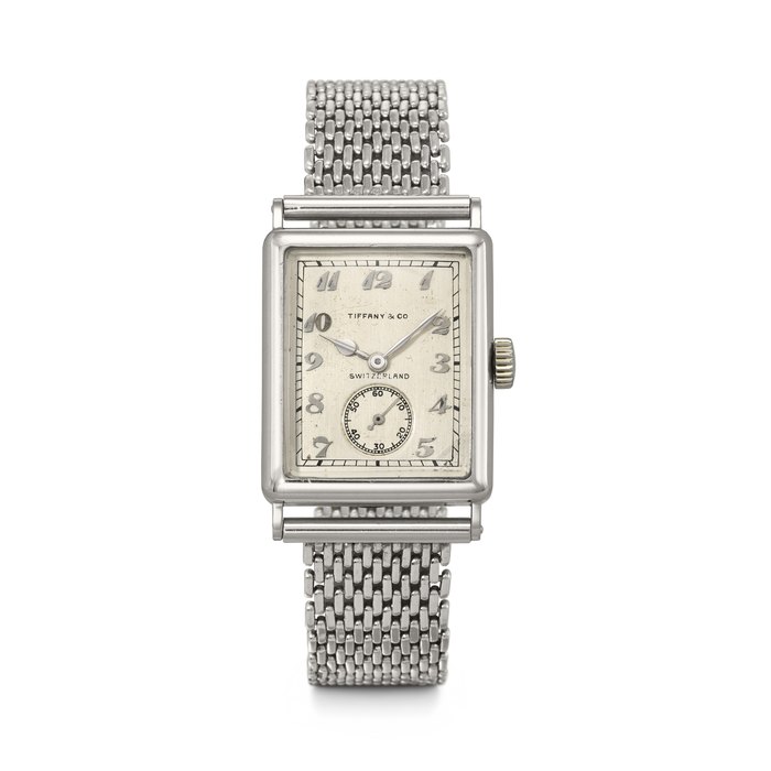 PATEK PHILIPPE. AN EXTREMELY RARE AND EARLY PLATINUM RECTANGULAR WRISTWATCH WITH BREGUET NUMERALS DIAL SIGNED TIFFANY & CO., MOVEMENT NO. 821'234, CASE NO. 608'219, MANUFACTURED IN 1929
