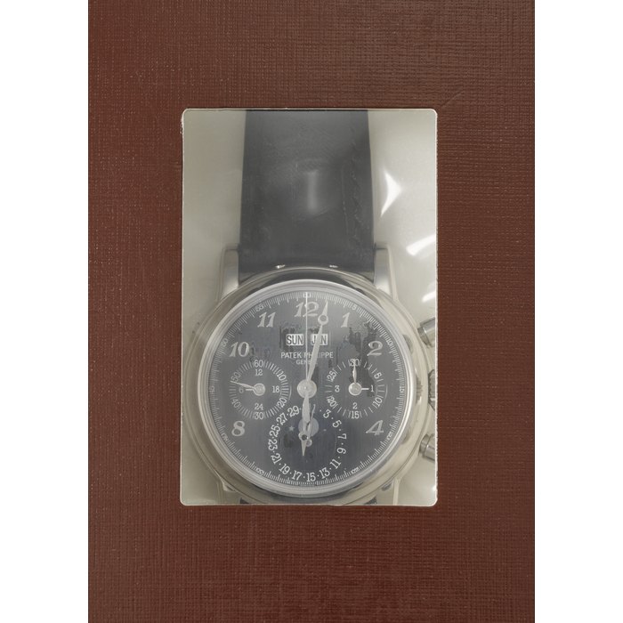 PATEK PHILIPPE. AN EXCEEDINGLY RARE AND HIGHLY ATTRACTIVE 18K WHITE GOLD SPECIAL EDITION PERPETUAL CALENDAR CHRONOGRAPH WRISTWATCH WITH MOON PHASES, 24-HOUR, LEAP YEAR INDICATION AND BREGUET NUMERALS, MADE FOR THE NEW OPENING OF THE GENEVA SALON IN 2006 REF. 3970EG-028, MOVEMENT NO. 3'048'464, CASE NO. 4'258'802, CIRCA 2007