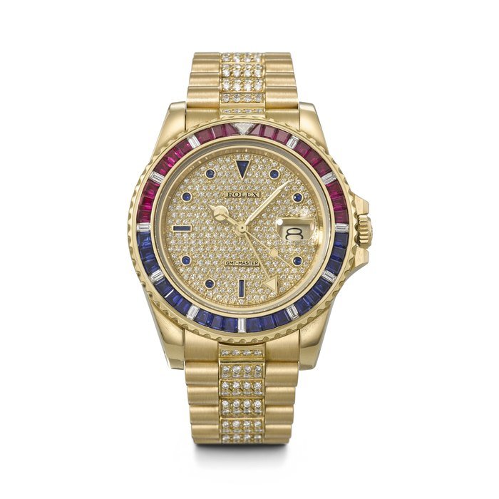 Rolex ROLEX. AN EXTREMELY RARE AND IMPORTANT 18K GOLD, DIAMOND, RUBY AND SAPPHIRE-SET AUTOMATIC DUAL TIME WRISTWATCH WITH SWEEP CENTRE SECONDS, DATE AND BRACELET GMT-MASTER 'SARU' MODEL, REF. 16758SARU, CASE NO. 9'067'516, CIRCA 1986 · 16758SARU