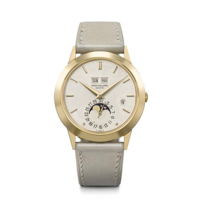 PATEK PHILIPPE. A VERY RARE AND ELEGANT 18K GOLD AUTOMATIC PERPETUAL CALENDAR WRISTWATCH WITH MOON PHASES AND LEAP YEAR INDICATION REF. 3450, MOVEMENT NO. 1'119'765, CASE NO. 2'808'541, CIRCA 1985