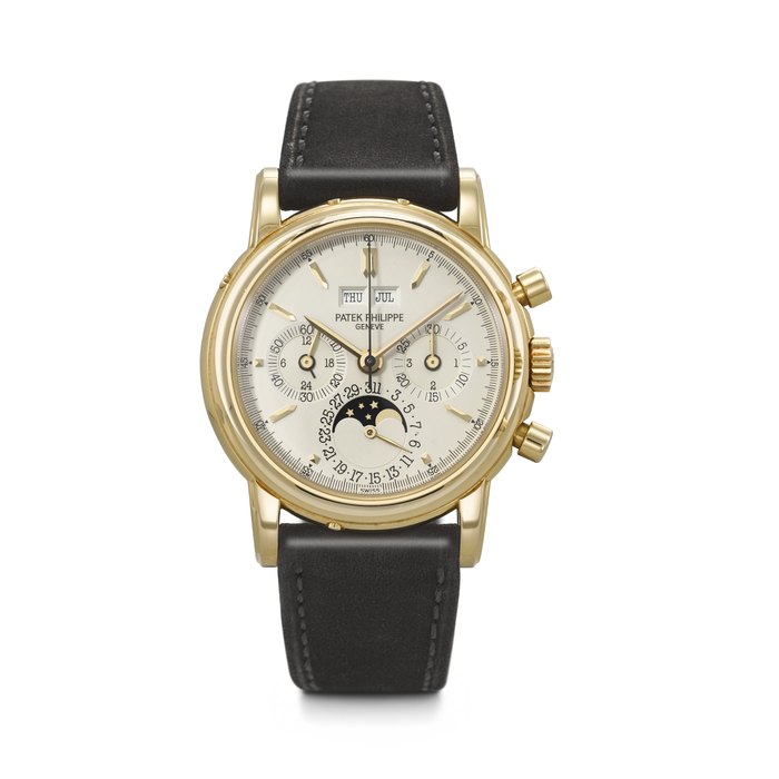 PATEK PHILIPPE. A RARE AND COVETED 18K GOLD PERPETUAL CALENDAR CHRONOGRAPH WRISTWATCH WITH MOON PHASES, 24-HOUR AND LEAP YEAR INDICATION REF. 3970E, MOVEMENT NO. 876'009, CASE NO. 2'900'856, CIRCA 1992