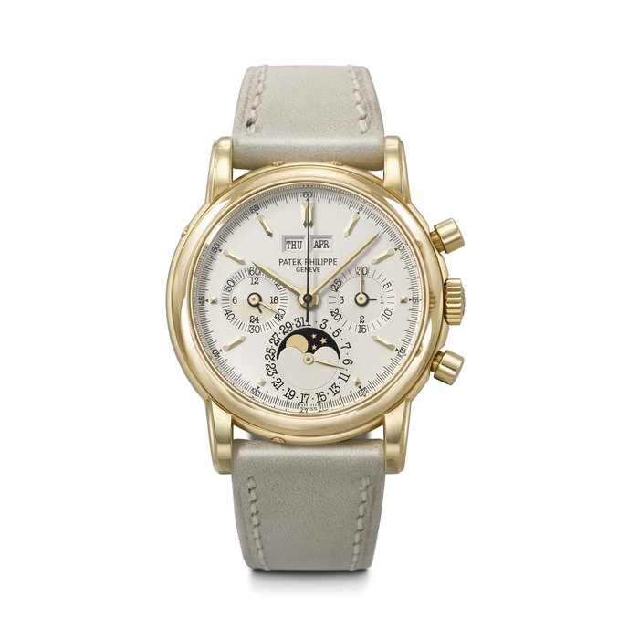 PATEK PHILIPPE. A RARE AND COVETED 18K GOLD PERPETUAL CALENDAR CHRONOGRAPH WRISTWATCH WITH MOON PHASES, 24-HOUR AND LEAP YEAR INDICATION REF. 3970EJ, MOVEMENT NO. 875'973, CASE NO. 2'873'832, MANUFACTURED IN 1991