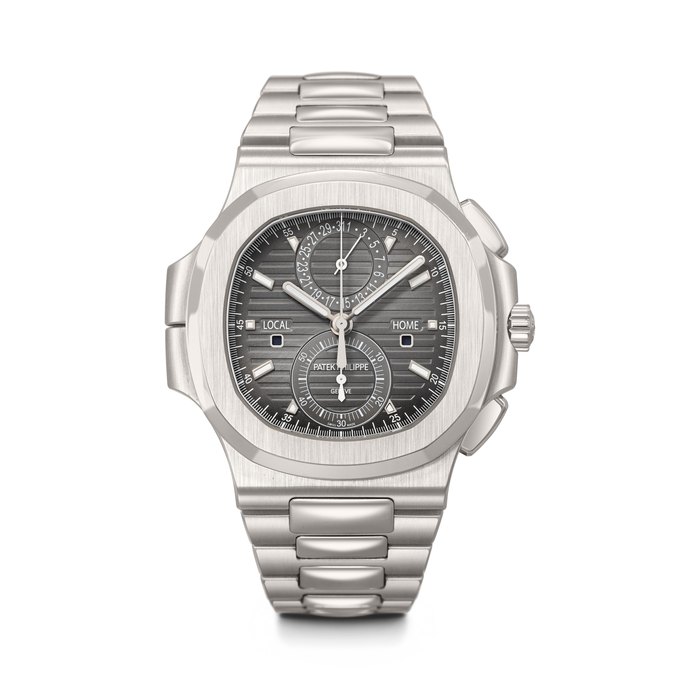 PATEK PHILIPPE. A LARGE AND ATTRACTIVE STAINLESS STEEL AUTOMATIC FLYBACK CHRONOGRAPH DUAL TIME WRISTWATCH WITH DATE, DAY/NIGHT INDICATION AND BRACELET NAUTILUS MODEL, REF. 5990/1A-001, MOVEMENT NO. 7'109'487, CASE NO. 6'198'820, CIRCA 2017