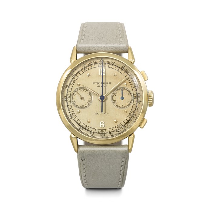 PATEK PHILIPPE. AN EXTREMELY RARE AND ATTRACTIVE 18K GOLD CHRONOGRAPH WRISTWATCH WITH SPIDER LUGS RETAILED BY ROLANDI, REF. 1579, MOVEMENT NO. 868'033, CASE NO. 664'470, MANUFACTURED IN 1951