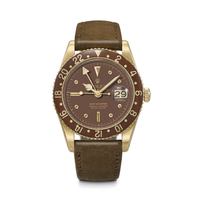 ROLEX. A HIGHLY RARE 18K GOLD DUAL TIME WRISTWATCH WITH SWEEP CENTRE SECONDS, DATE AND BAKELITE BEZEL GMT-MASTER MODEL, REF. 6542⁄8, CASE NO. 486'431, CIRCA 1959