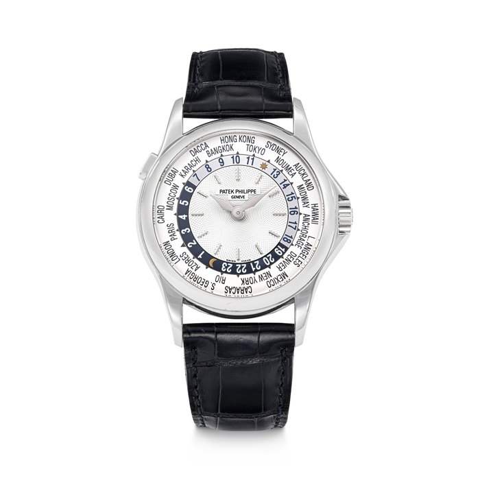 PATEK PHILIPPE. AN 18K WHITE GOLD AUTOMATIC WORLD TIME WRISTWATCH REF. 5110G-001, MOVEMENT NO. 3'206'589, CASE NO. 4'109'730, CIRCA 2000