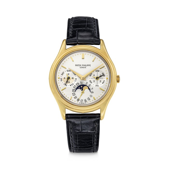 PATEK PHILIPPE. A RARE 18K GOLD AUTOMATIC PERPETUAL CALENDAR WRISTWATCH WITH MOON PHASES, 24 HOUR AND LEAP YEAR INDICATION REF. 3940 "SECOND SERIES", MOVEMENT NO. 772'129, CASE NO. 2'884'570, CIRCA 1990