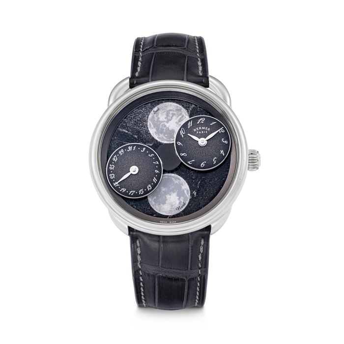 HERMÈS. AN 18K WHITE GOLD AUTOMATIC WRISTWATCH WITH DUAL MOONPHASE AND DATE INDICATION ARCEAU L’HEURE DE LA LUNE MODEL, REF. AR1.890F, MOVEMENT NO. 255’600, CASE NO. 3’723’923, CIRCA 2025