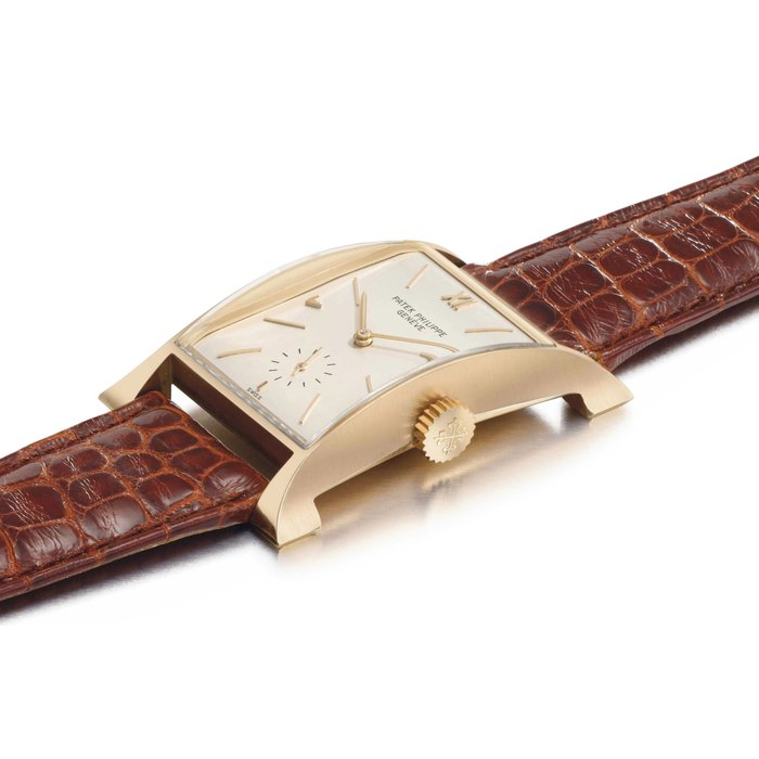 PATEK PHILIPPE. A FINE AND RARE 18K PINK GOLD RECTANGULAR WRISTWATCH WITH FLARED SIDES SIGNED PATEK PHILIPPE, GENEVE, MOVEMENT NO. 971395, CASE NO. 653904, REF. 2441, MANUFACTURED IN 1949