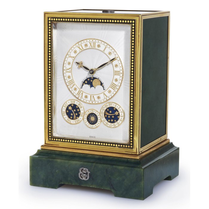 CARTIER. A VERY RARE AND IMPORTANT 18K GOLD, DIAMOND AND NEPHRITE PETITE SONNERIE ASTRONOMICAL ALARM DESK CLOCK WITH DAY, DATE AND MOON PHASES SIGNED CARTIER, MOVEMENT SIGNED EUROPEAN WATCH AND CLOCK CO, FRANCE, MOVEMENT NO. 11323, ALSO STAMPED NO. 2390, 4188 AND 1352, CIRCA 1925
