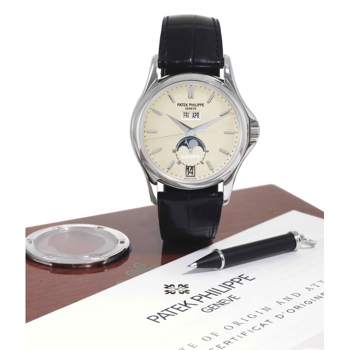 PATEK PHILIPPE. A FINE AND RARE LIMITED EDITION 18K WHITE GOLD AUTOMATIC ANNUAL CALENDAR WRISTWATCH WITH CENTER SECONDS, MOON PHASES, 24 HOURS AND ADDITIONAL 18K WHITE GOLD CASE BACK SIGNED PATEK PHILIPPE, GENEVE, WEMPE, NO. 029/125, MOVEMENT NO. 3360262, CASE NO. 4213392, REF. 5125, MANUFACTURED IN 2003