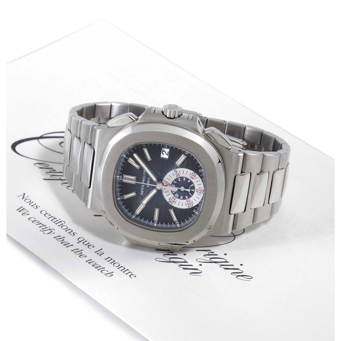 PATEK PHILIPPE. A FINE STAINLESS STEEL AUTOMATIC CHRONOGRAPH WRISTWATCH WITH ORIGINAL CERTIFICATE AND BRACELET SIGNED PATEK PHILIPPE, GENEVA, NAUTILUS MODEL, MOVEMENT NO. 3668500, CASE NO. 4420297, REF. 5980/1A, CIRCA 2008