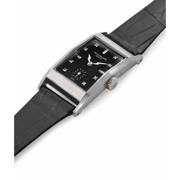 Patek Philippe. A Fine and Very Rare Platinum and Diamond-Set Rectangular Wristwatch with Black Dial SIGNED PATEK PHILIPPE, GENÈVE, REF. 2461, MOVEMENT NO. 975'361, CASE NO. 672'286, MANUFACTURED IN 1953