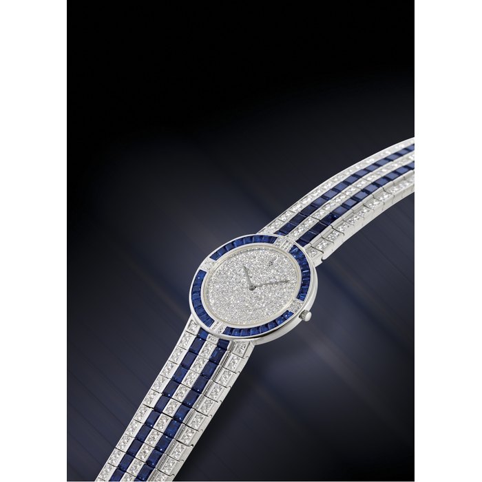 CORUM IMPRESSIVE PLATINUM, DIAMOND AND SAPPHIRE-SET QUARTZ WRISTWATCH WITH BRACELET CASE NO. 475647 REF. 50.322.79 V-133, CIRCA 1995
