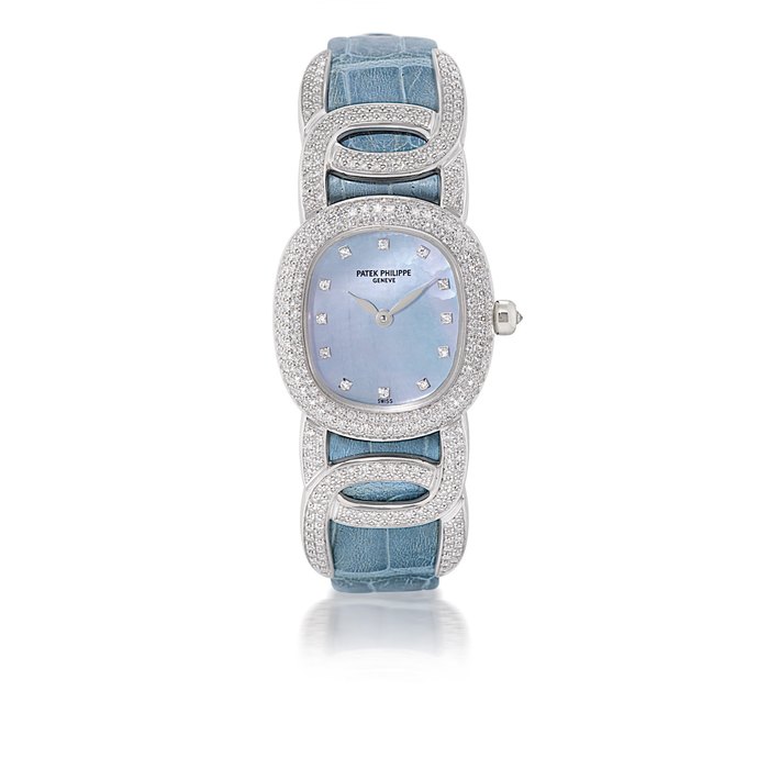 PATEK PHILIPPE, REF. 4832G, GOLDEN ELLIPSE LADY'S OVAL WHITE GOLD, MOTHER-OF-PEARL AND DIAMOND-SET QUARTZ WRISTWATCH WITH UNUSUAL LUGS MOVEMENT 1969740, CASE 4057675, CIRCA 1995