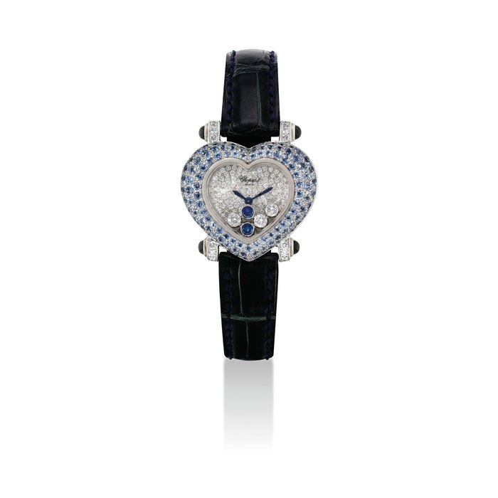 CHOPARD. A LADY'S 18K WHITE GOLD, DIAMOND AND SAPPHIRE-SET HEART-SHAPED WRISTWATCH SIGNED CHOPARD, GENEVE, HAPPY DIAMONDS MODEL, REF. 20/6602/402, CASE NOS. 483'631 AND 550 1, CIRCA 2005