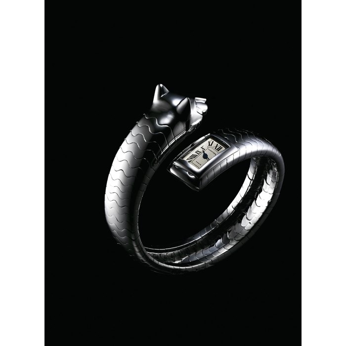 CARTIER. A LADY'S VERY FINE AND RARE 18K WHITE GOLD AND EMERALD-SET BANGLE WATCH SIGNED CARTIER, PARIS, PANTHERE MODEL, CASE NO. 720'169, CIRCA 1995
