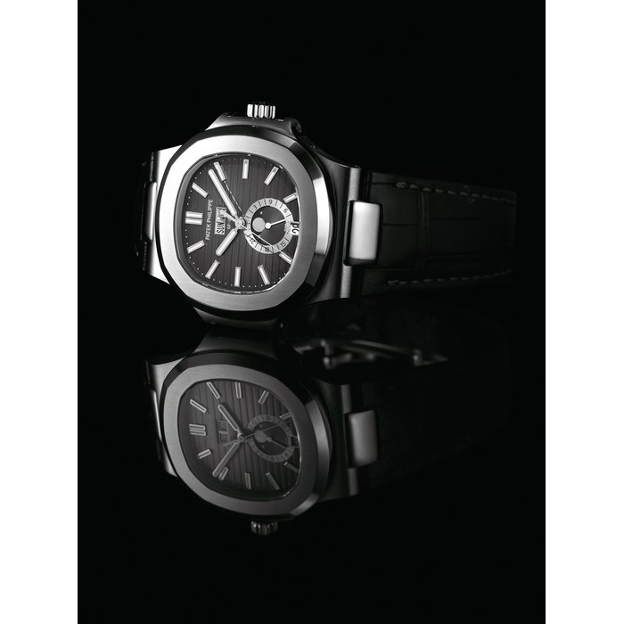 PATEK PHILIPPE. A FINE STAINLESS STEEL AUTOMATIC ANNUAL CALENDAR WRISTWATCH WITH SWEEP CENTRE SECONDS, MOON PHASES AND 24 HOUR INDICATION, ORIGINAL CERTIFICATE AND BOX SIGNED PATEK PHILIPPE, GENEVE, NAUTILUS MODEL, REF. 5726, MOVEMENT NO. 5'524'884, CASE NO. 4'734'300, CIRCA 2010