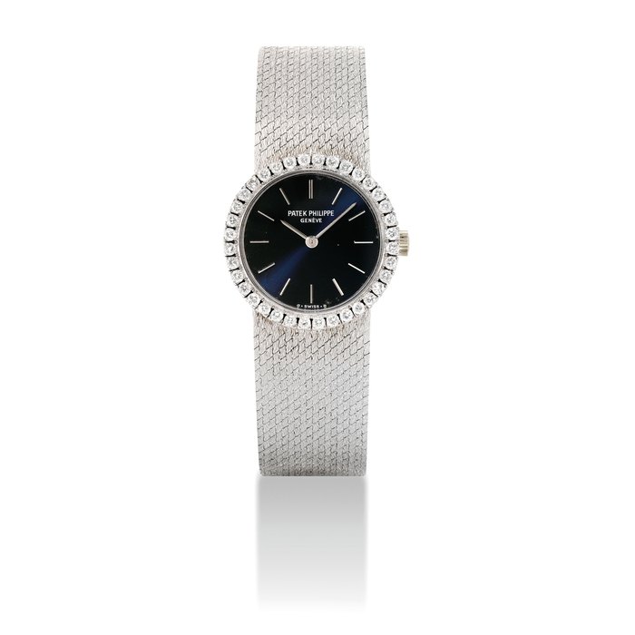 PATEK PHILIPPE. A LADY'S 18K WHITE GOLD AND DIAMOND-SET BRACELET WATCH SIGNED PATEK PHILIPPE, GENEVE, REF. 4182, MOVEMENT NO. 1'270'217, CASE NO. 2'777'837, CIRCA 1980