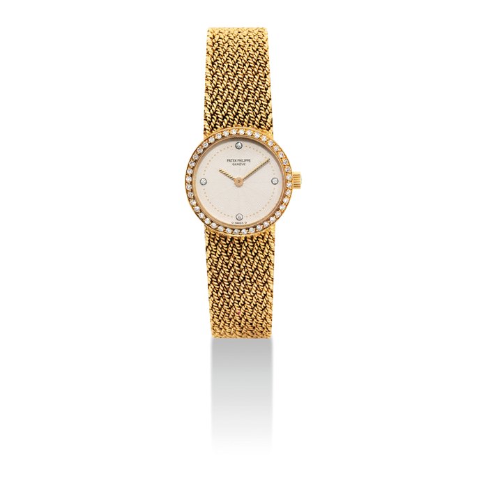 PATEK PHILIPPE. A LADY'S 18K GOLD AND DIAMOND-SET BRACELET WATCH SIGNED PATEK PHILIPPE, GENEVE, REF. 4522/1, MOVEMENT NO. 1'410'069, CASE NO. 2'809'942, CIRCA 1985