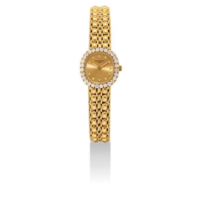 PATEK PHILIPPE. A LADY'S FINE 18K GOLD AND DIAMOND-SET CUSHION-SHAPED BRACELET WATCH SIGNED PATEK PHILIPPE, GENEVE, REF. 4772/2, MOVEMENT NO. 1'602'024, CASE NO. 2'833'854, MANUFACTURED IN 1986